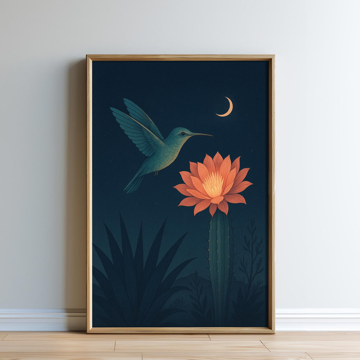 A framed illustration depicting a hummingbird hovering near a cactus flower, with a crescent moon in the night sky.