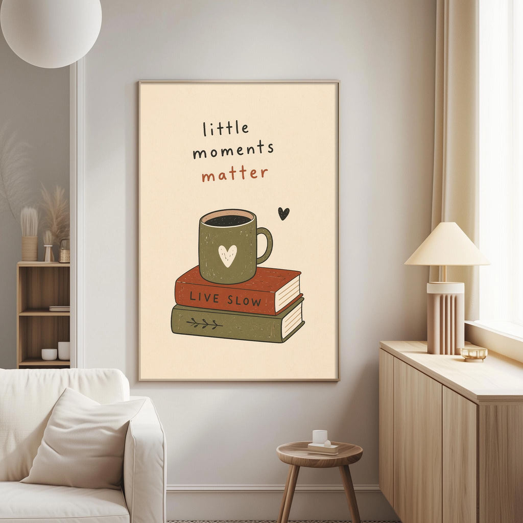 a cozy living room with a framed poster on the wall that reads "little moments matter" and includes an illustration of a book and a mug.