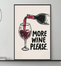 a living room with a gray couch, a coffee table, and a framed poster on the wall that says "MORE WINE PLEASE".