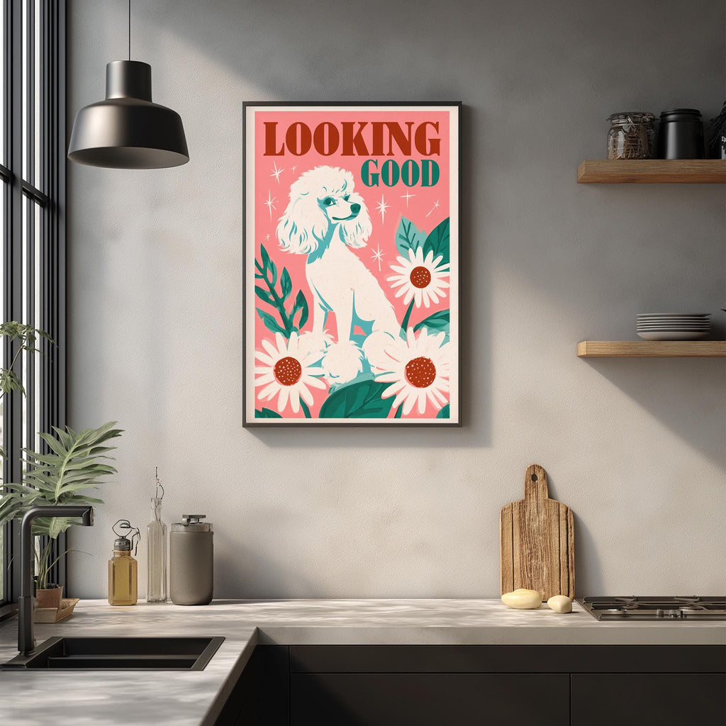a kitchen counter with a framed poster of a poodle and flowers hanging on the wall above it.