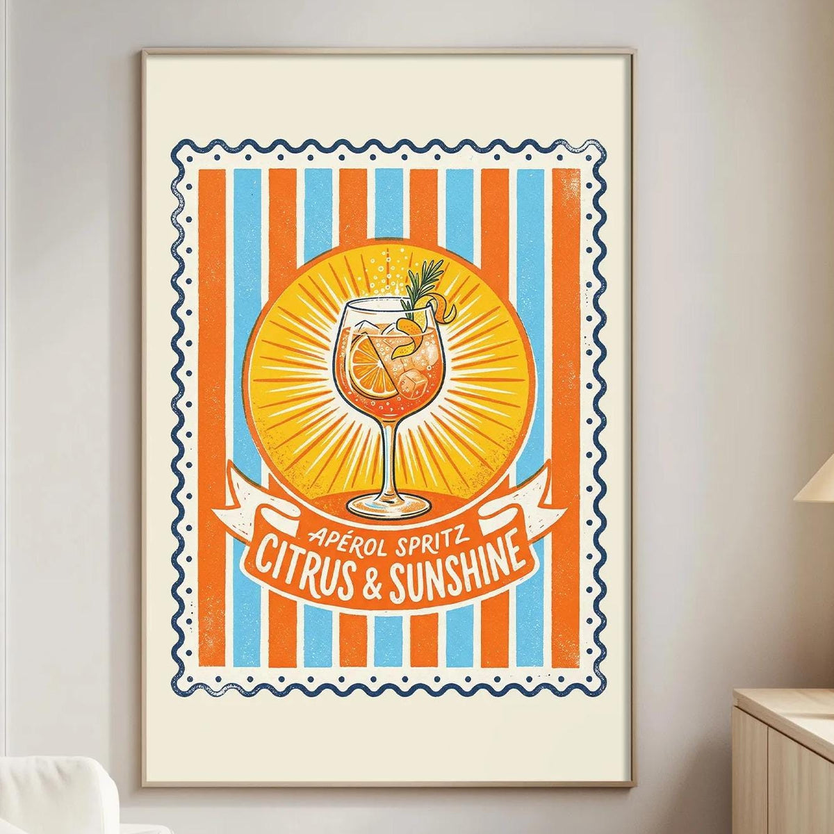 a poster of a cocktail glass with a citrus and sunshine theme, hanging on a wall in a living room.