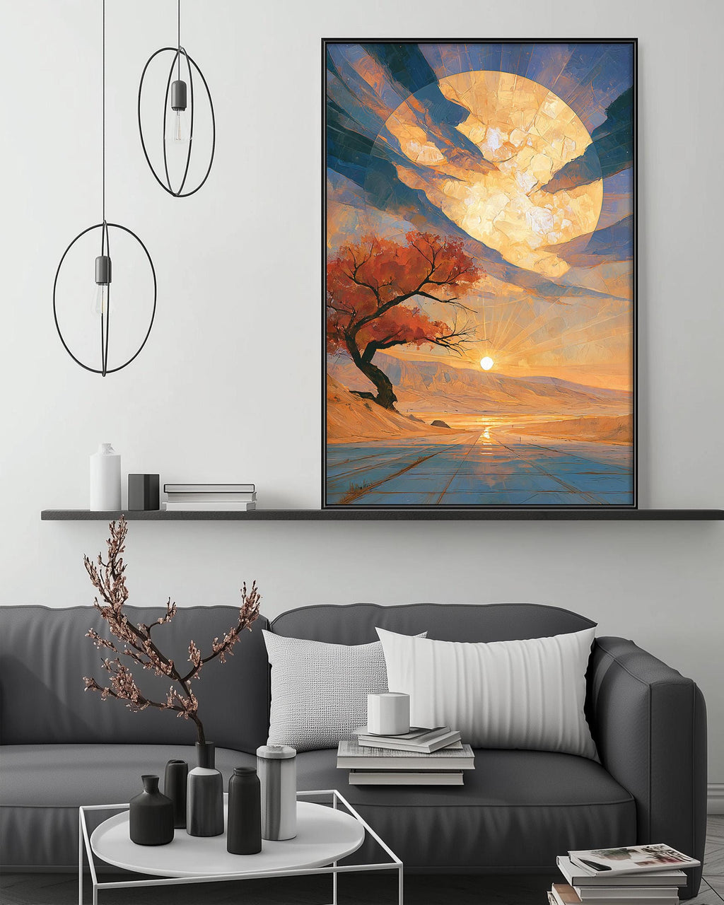 a modern living room with a gray sofa, a coffee table, and a large framed painting depicting a serene landscape with a tree and a sunset.