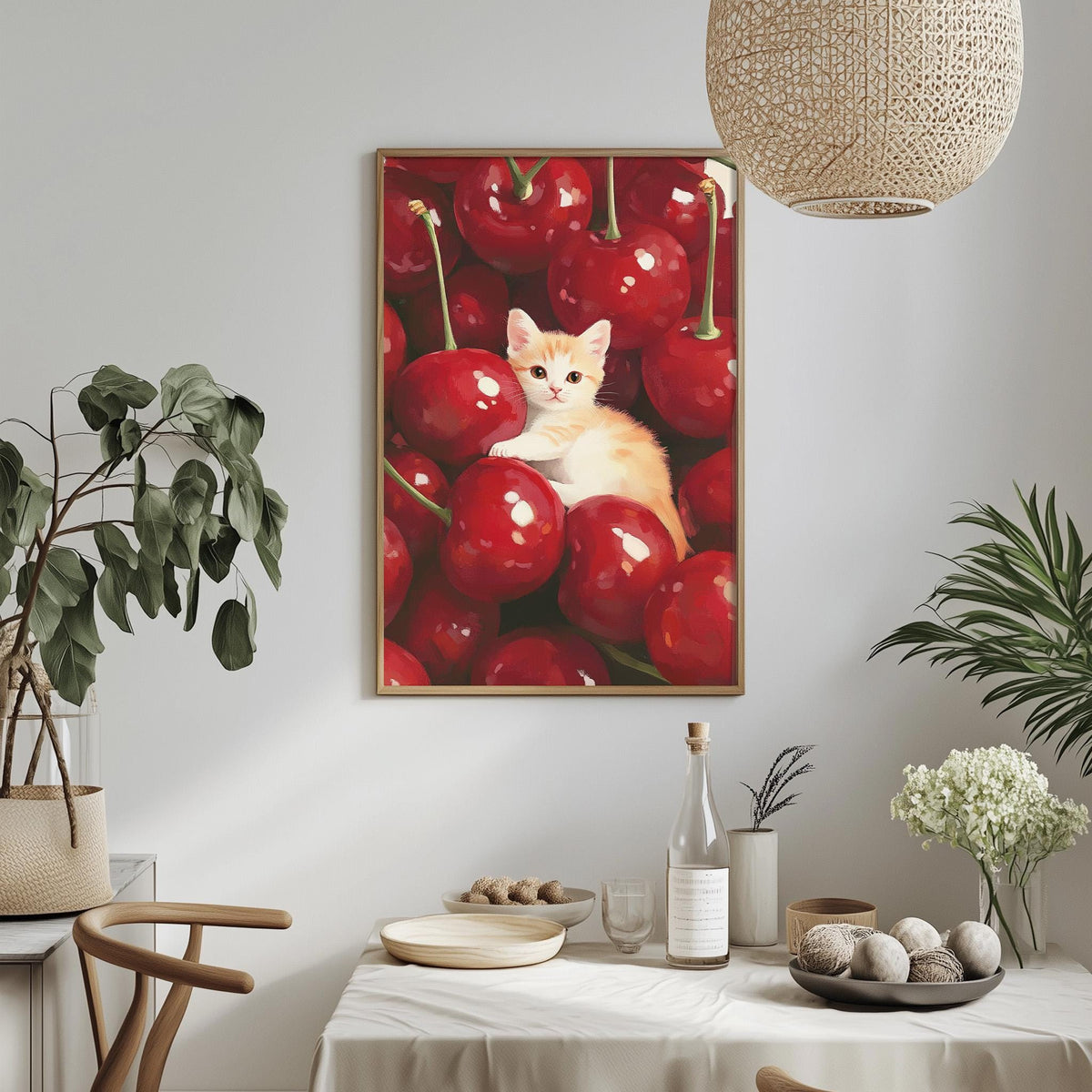 a cozy dining area with a table set for two, a potted plant, a hanging light fixture, and a framed painting of a cat sitting among red cherries.