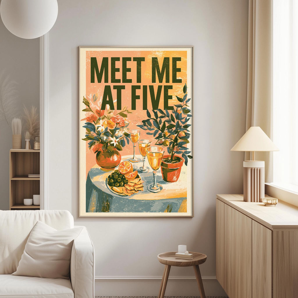 a living room with a framed poster on the wall that reads "Meet Me at Five". The poster depicts a table with various food items, including a vase of flowers, a plate of fruit, and a wine glass. The room also includes a couch, a lamp, and a small table.