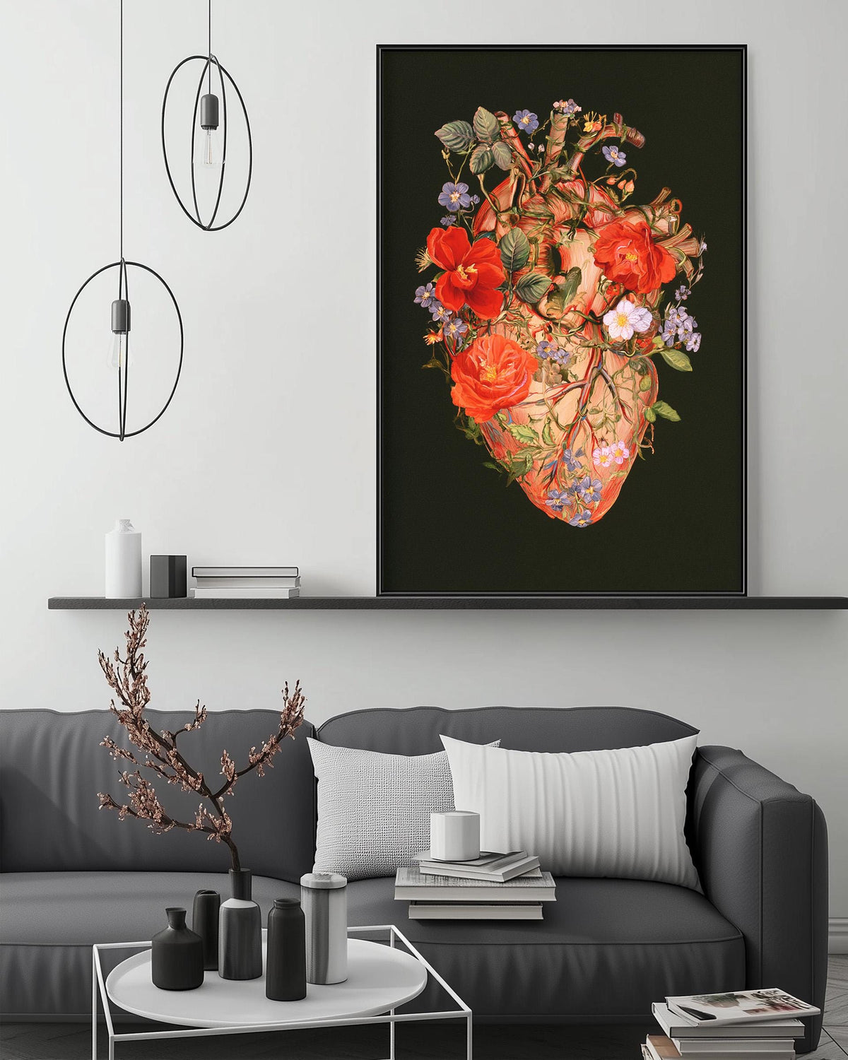 a modern living room with a gray sofa, a coffee table, and a large framed artwork depicting a floral heart on the wall.