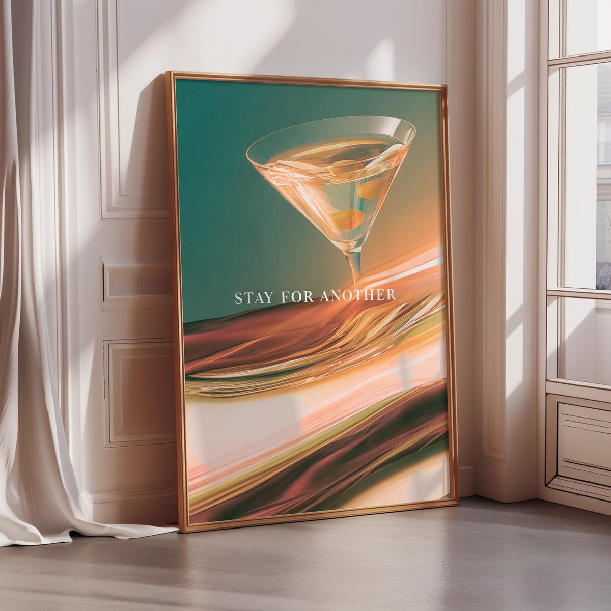 A framed poster with a vibrant, abstract design featuring a martini glass and the text "STAY FOR ANOTHER" is displayed on a wall.