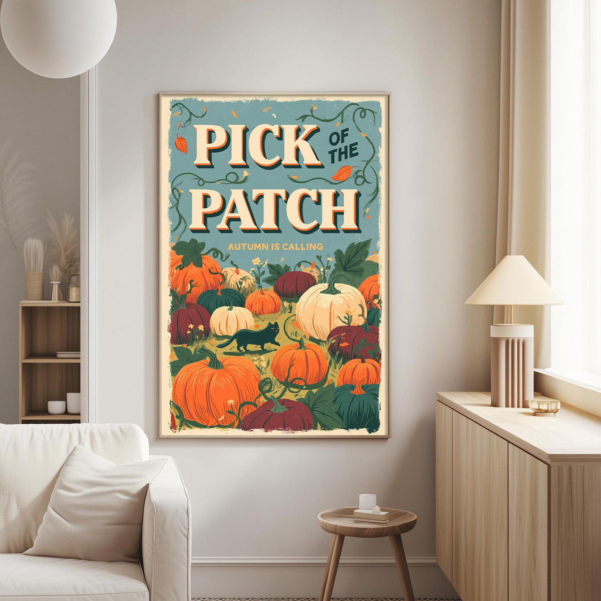 a poster of a pumpkin patch with the text "Pick of the Patch" and "Autumn is calling" on it, hanging on a wall in a living room.
