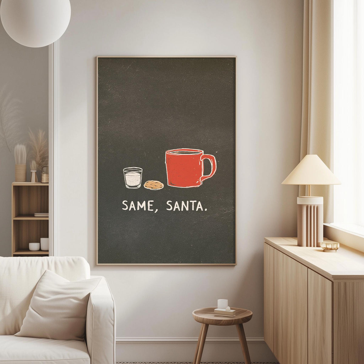 a cozy living room with a white couch, a wooden side table, and a framed poster on the wall that reads "SAME, SANTA."