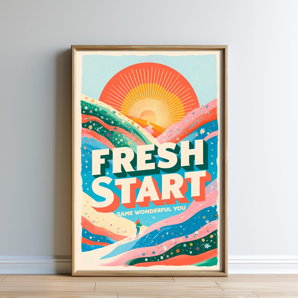 The image is a framed poster with a vibrant, colorful design featuring a sun, mountains, and a person walking. The text on the poster reads "FRESH START" and "SAME WONDERFUL YOU".