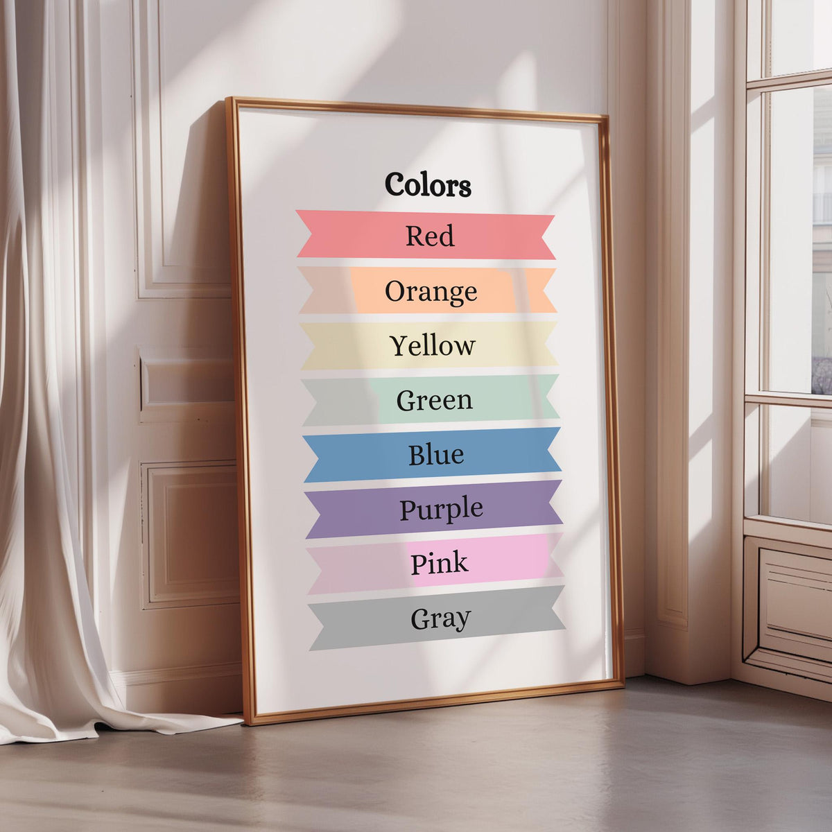 A framed poster displaying a color spectrum with the words "Colors" at the top, listing colors in a rainbow order from red to pink.