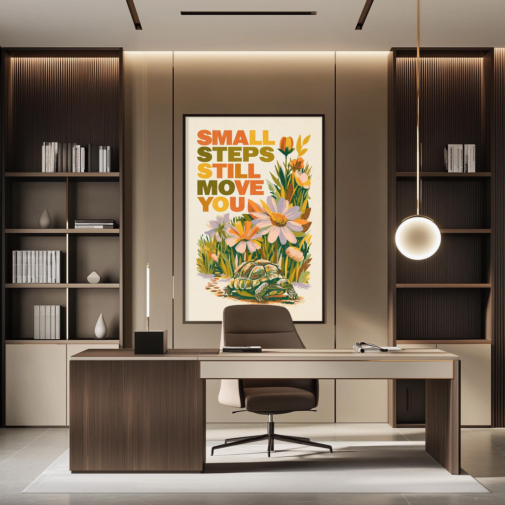 a modern office space with a large framed poster on the wall that reads "Small steps still move you". The office has a wooden desk, a chair, and a bookshelf filled with books. The overall design and decor create a professional and inspiring atmosphere.