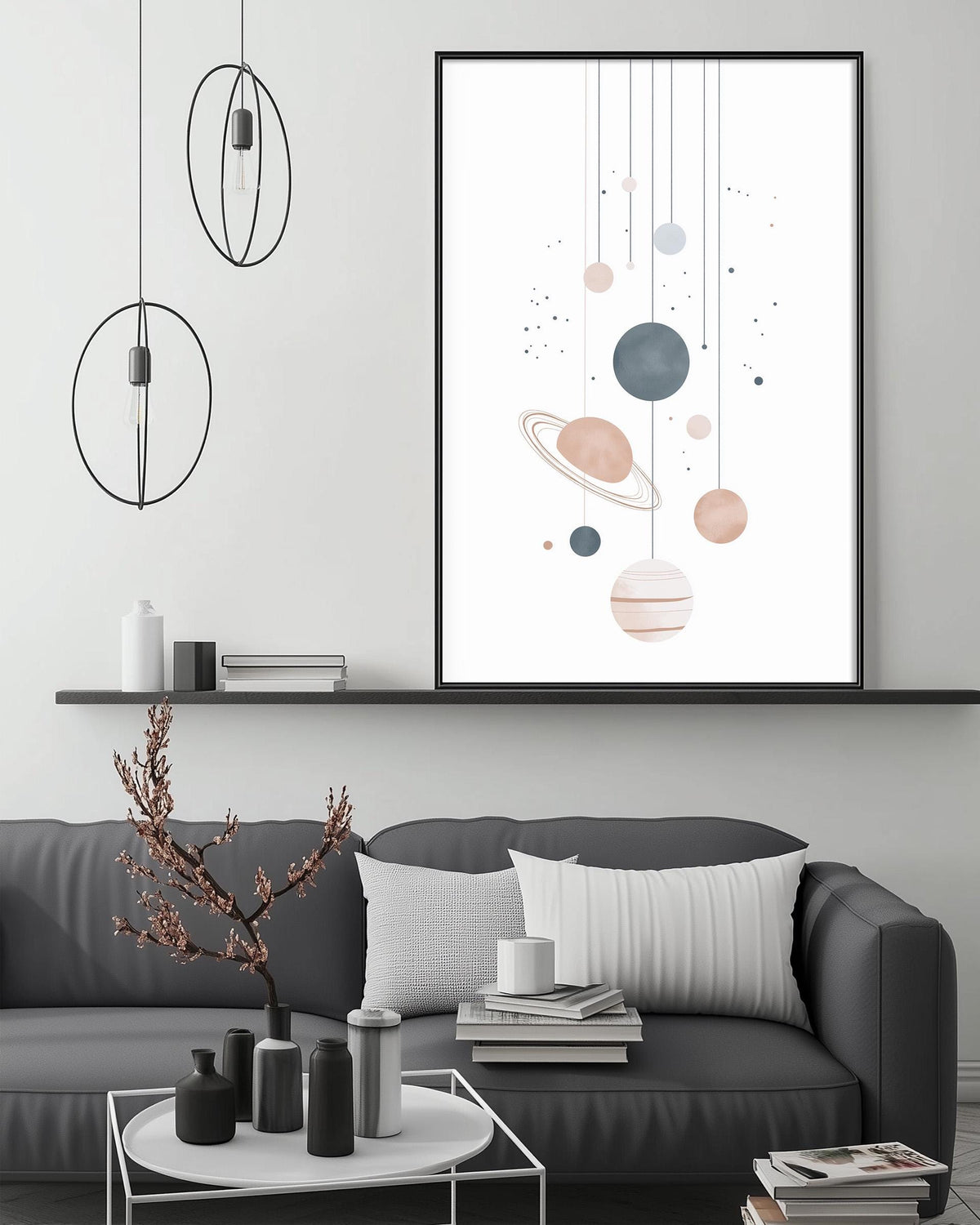 a modern living room with a gray sofa, a coffee table, and a large framed artwork depicting a space scene with planets hanging from the ceiling.
