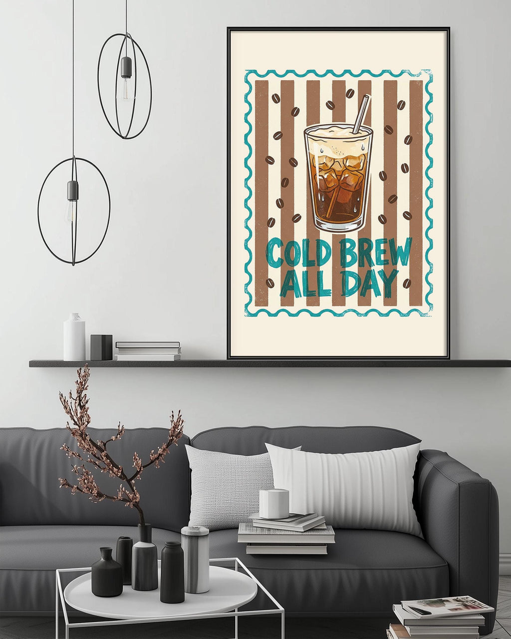 a cozy living room with a gray couch, a coffee table, and a framed poster on the wall that says "COLD BREW ALL DAY".