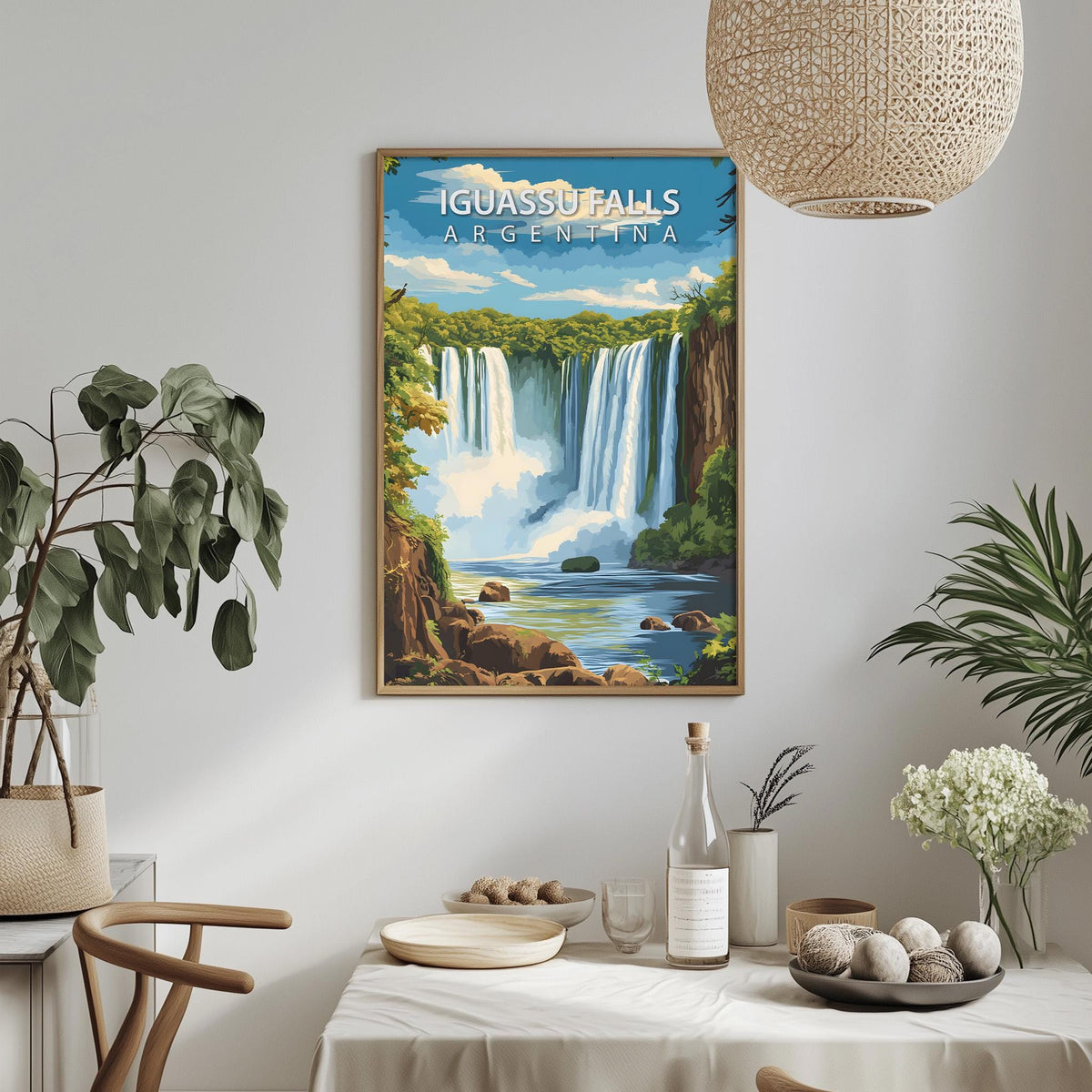 a framed poster of Iguas Falls in Argentina hanging on a wall, with a dining table and chairs in the foreground.
