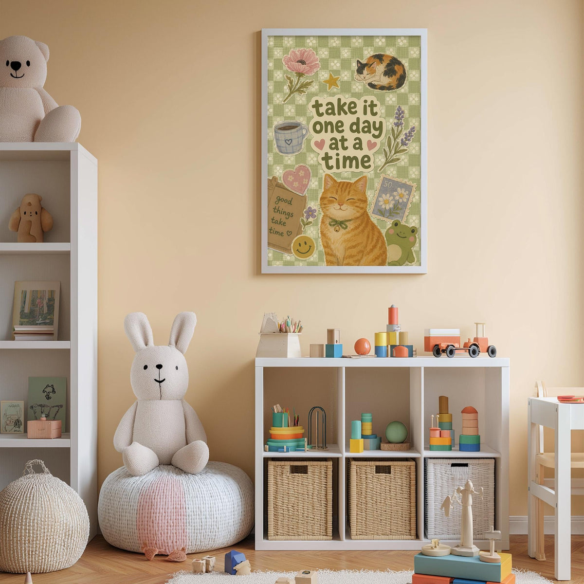 A child's bedroom with a white bookshelf, a stuffed rabbit, and a colorful toy box filled with toys. Above the bookshelf is a framed poster with a cat and the text "Take it one day at a time".