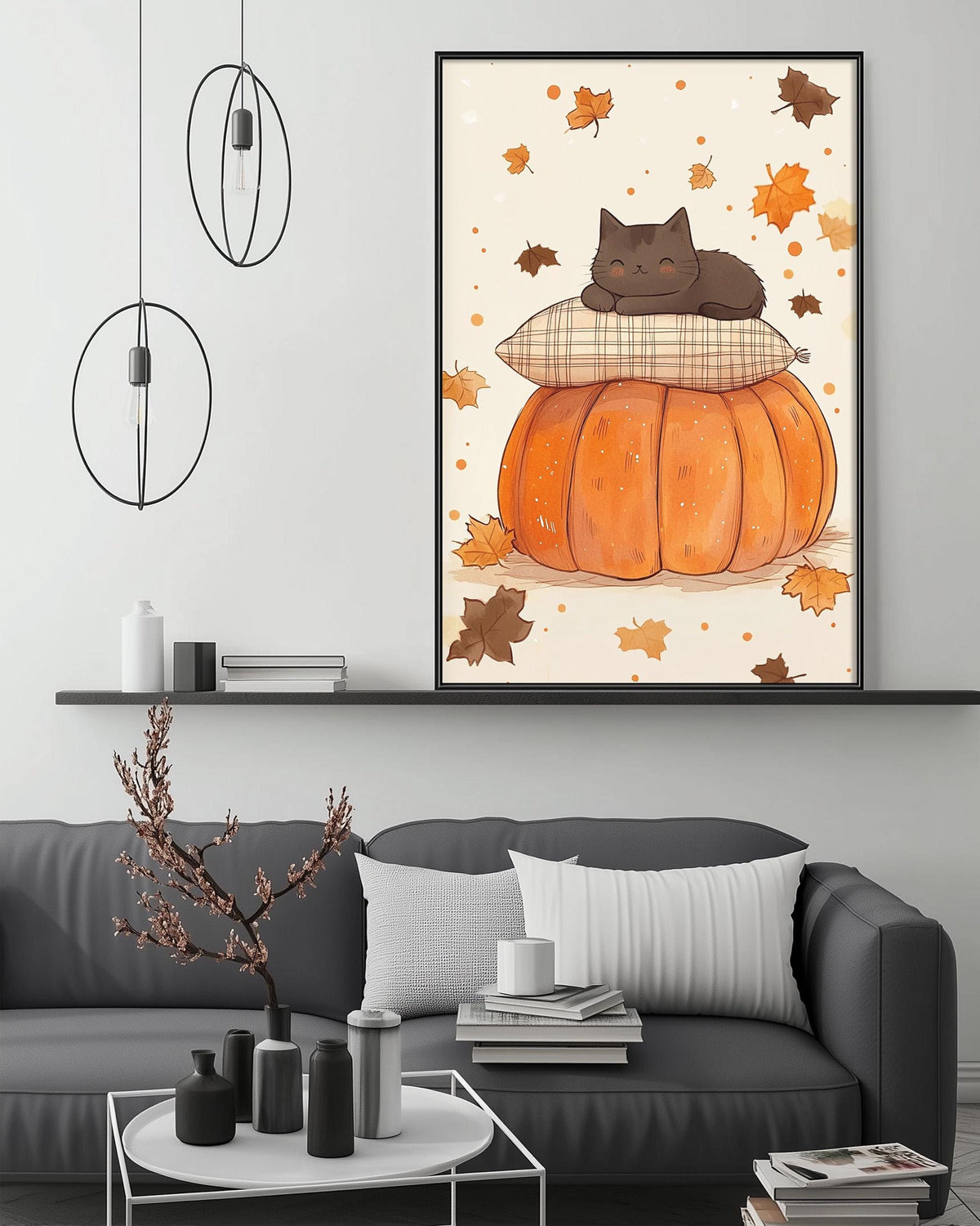 a cozy living room with a gray sofa, a coffee table, and a framed illustration of a cat resting on a pumpkin. The room has a minimalist and modern design, with a black pendant light hanging above the sofa and a shelf displaying decorative items.