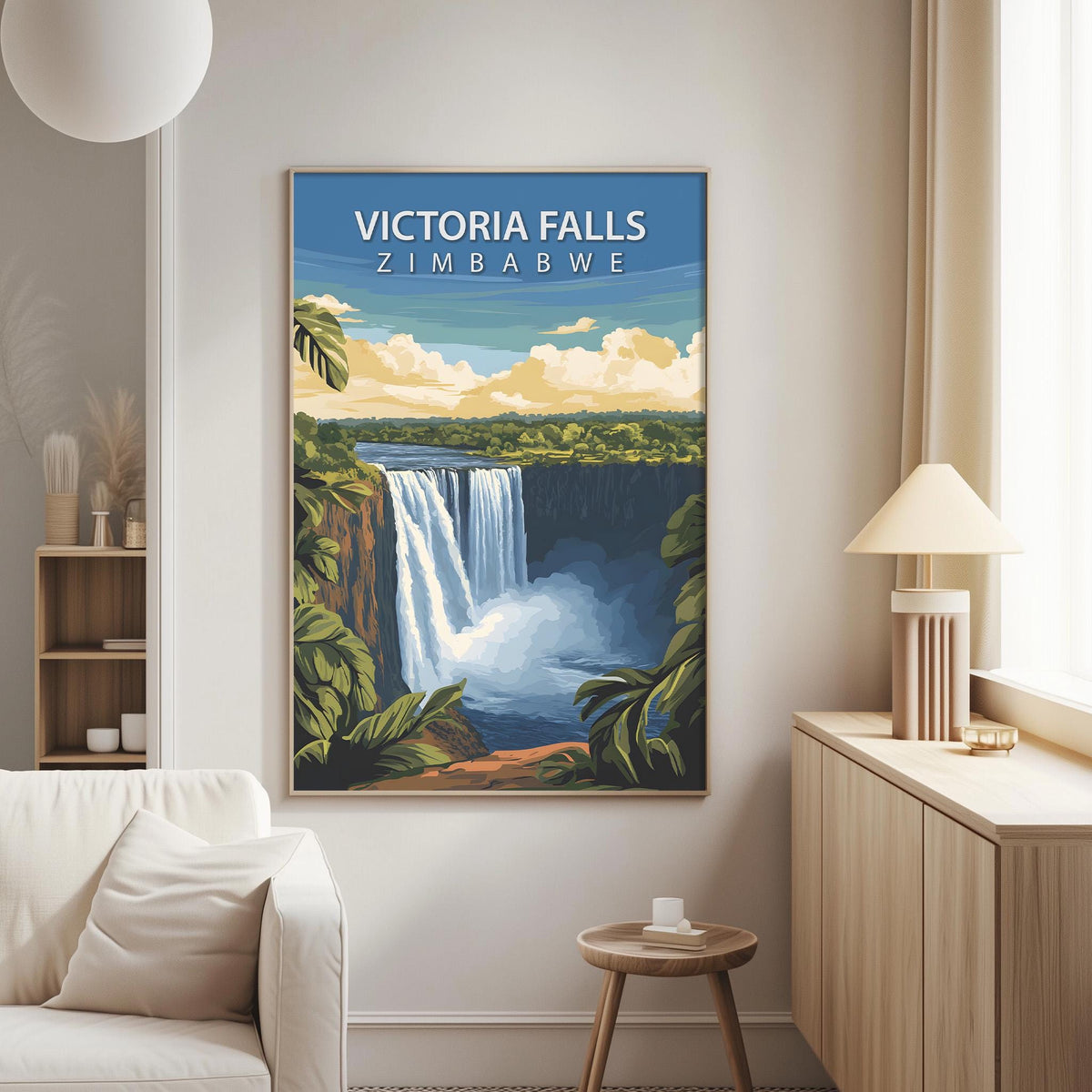 a large framed poster of Victoria Falls hanging on a wall in a living room.