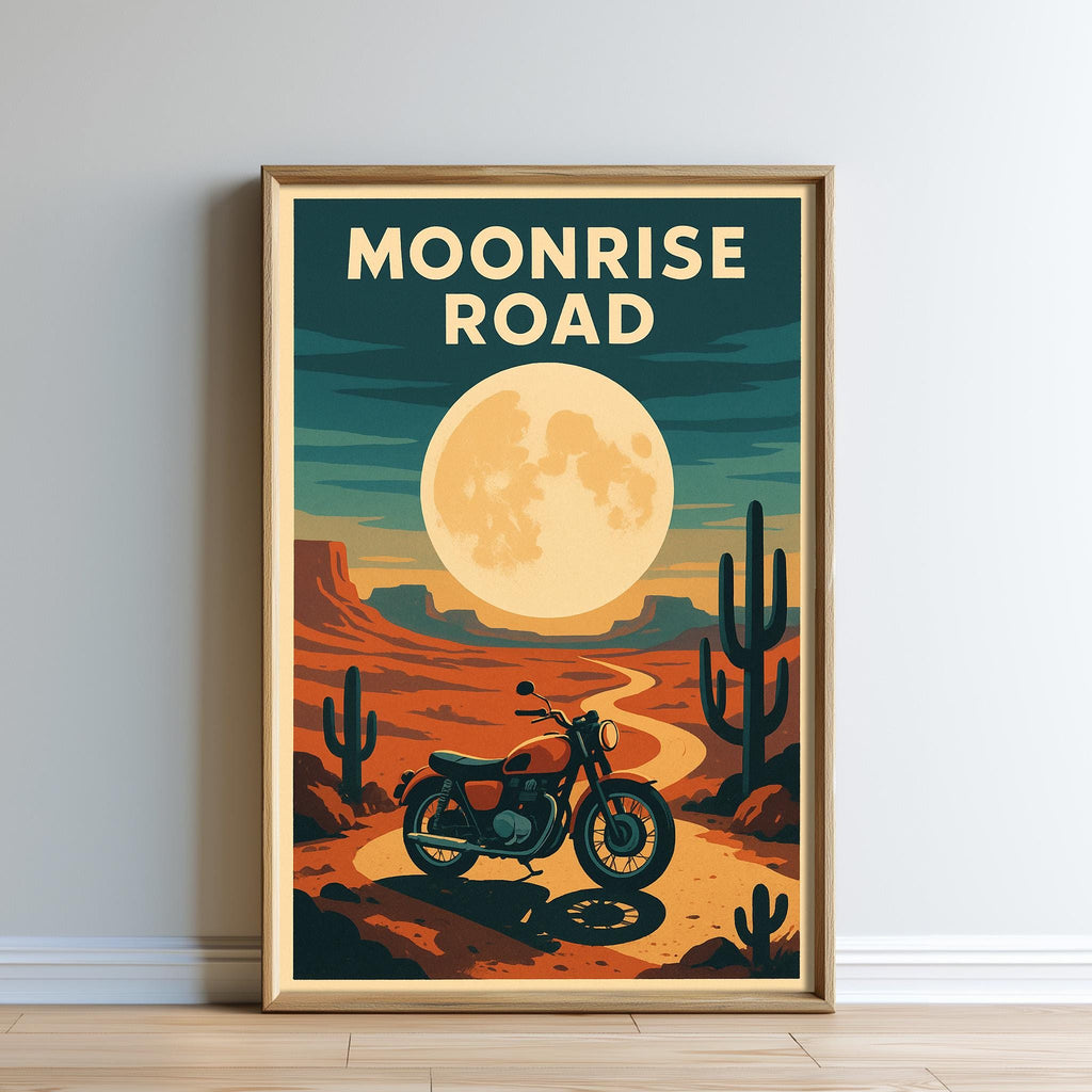 The image is a framed poster depicting a motorcycle on a desert road with a large moon in the background.