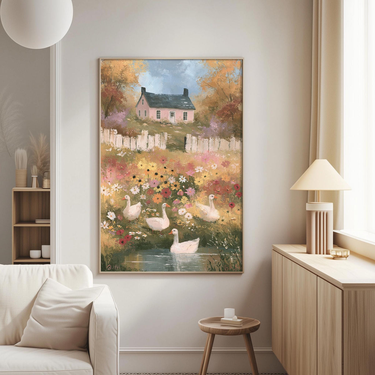a cozy living room with a large painting of a house and a pond with ducks hanging on the wall. The painting is surrounded by a wooden frame and is the focal point of the room. The room also includes a white sofa, a wooden side table, and a lamp, creating a warm and inviting atmosphere.