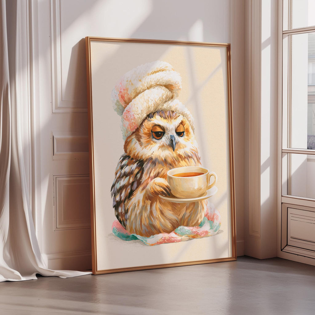 A framed painting of an owl wearing a hat and holding a cup of tea.