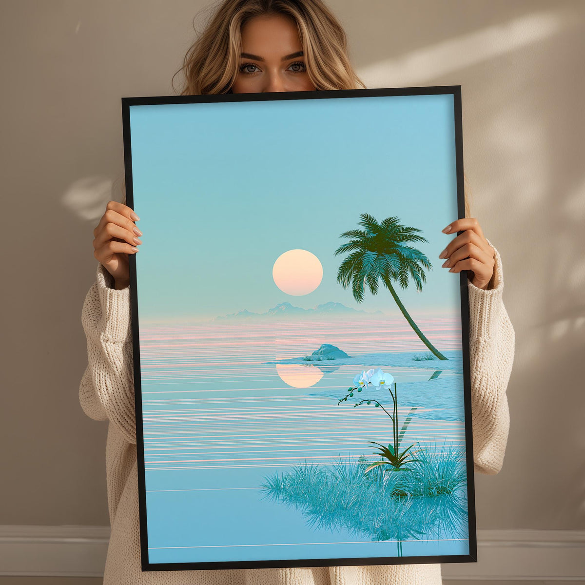 A woman holds up a framed picture depicting a serene tropical landscape with a palm tree, a sunset, and a body of water.