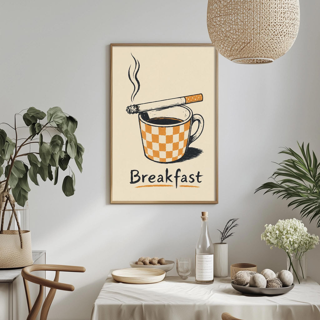 a framed poster of a cup of coffee with a cigarette on top, accompanied by the word "Breakfast" written below it. The poster is hanging on a wall, and there is a dining table with various items on it, including a bottle, a bowl, and a vase.