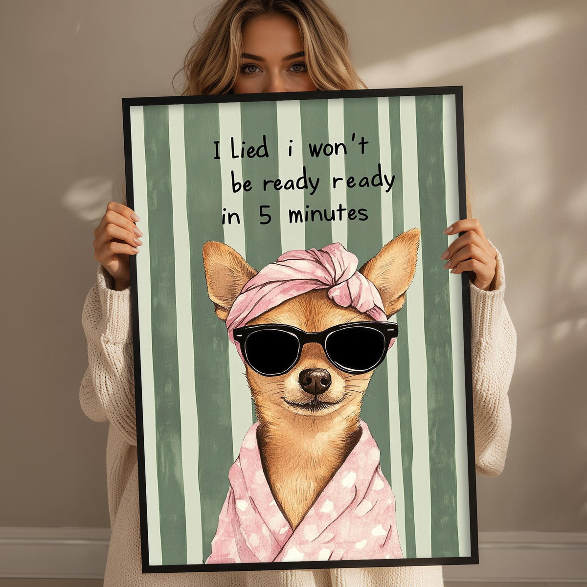 A woman holding a framed picture of a dog wearing sunglasses and a pink scarf, with text above the image that says "I Lied I Won't be Ready Ready in 5 Minutes".