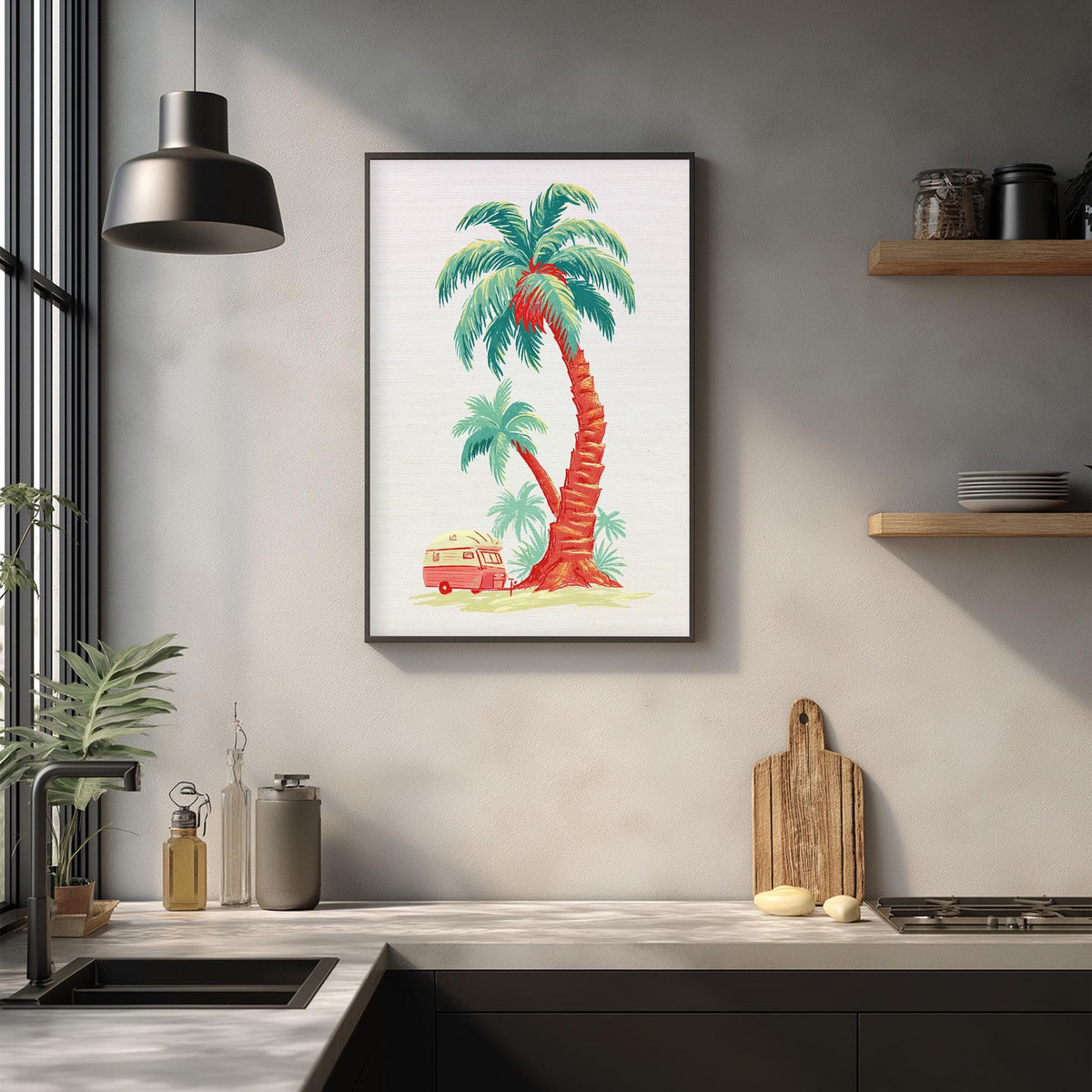a kitchen counter with various items, including a framed picture of a palm tree, a wooden cutting board, and a sink.