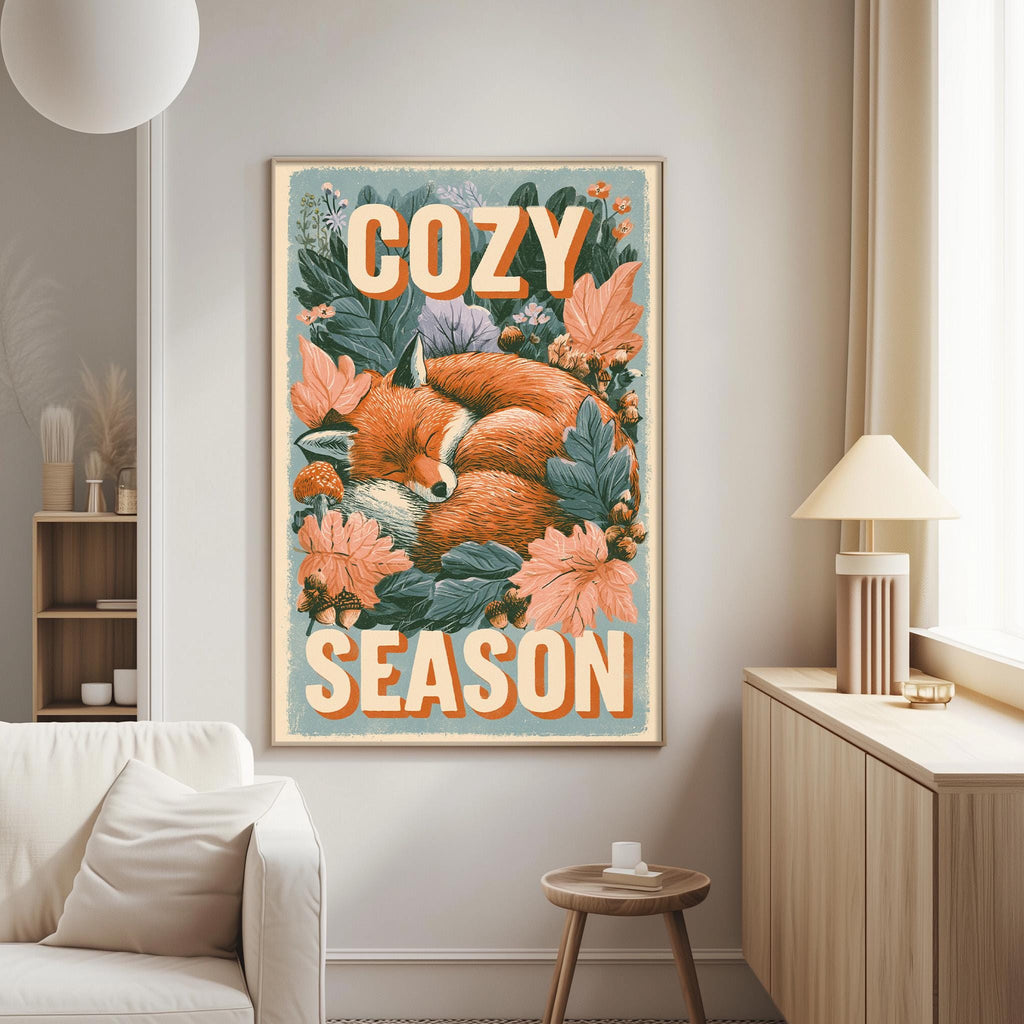a cozy poster of a sleeping fox surrounded by flowers and leaves, hanging on a wall in a living room.