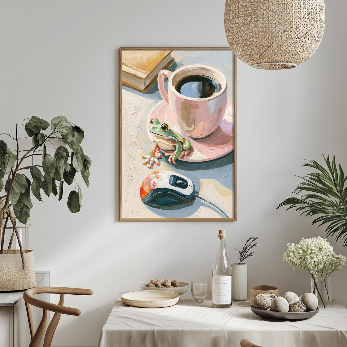 a framed painting of a frog sitting on a coffee cup, surrounded by various objects such as a computer mouse, a plant, and a bowl of fruit.