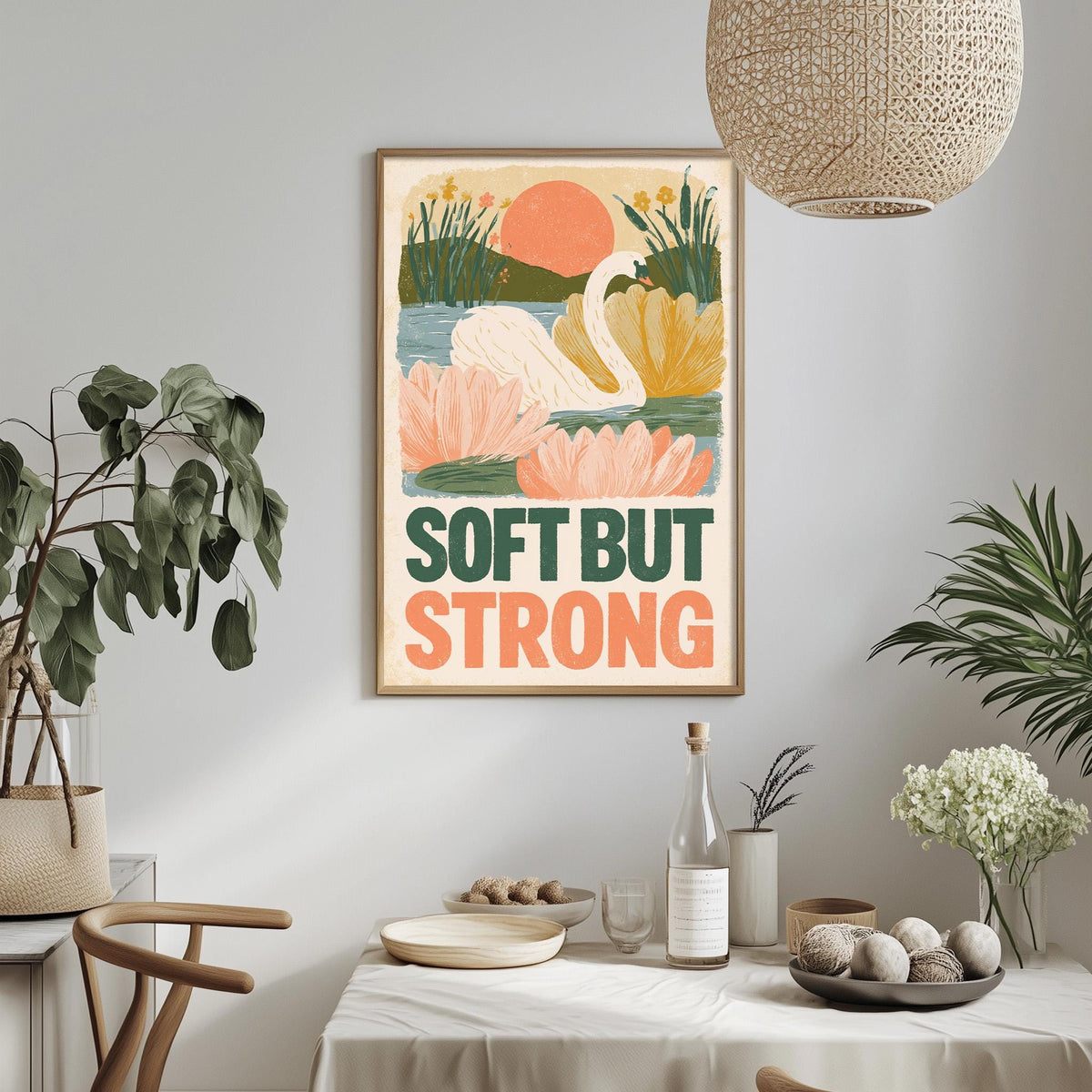 a framed poster with a colorful illustration of a swan and flowers, hanging on a wall above a dining table with various decorative items and plants.