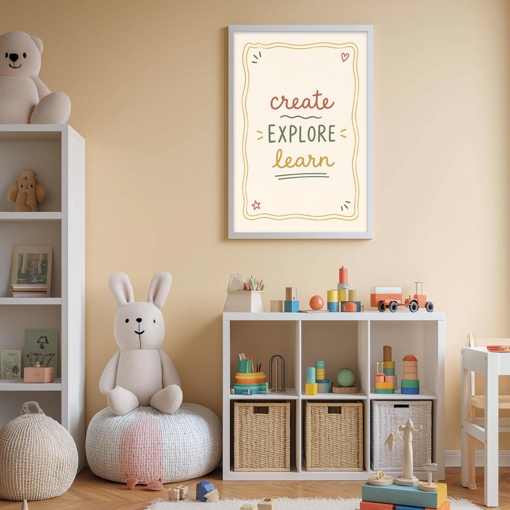 A cozy and colorful children's bedroom with a white bookshelf, a plush rabbit, and a toy train set. Above the bookshelf is a framed poster with the text "Create explore learn" in a playful font.
