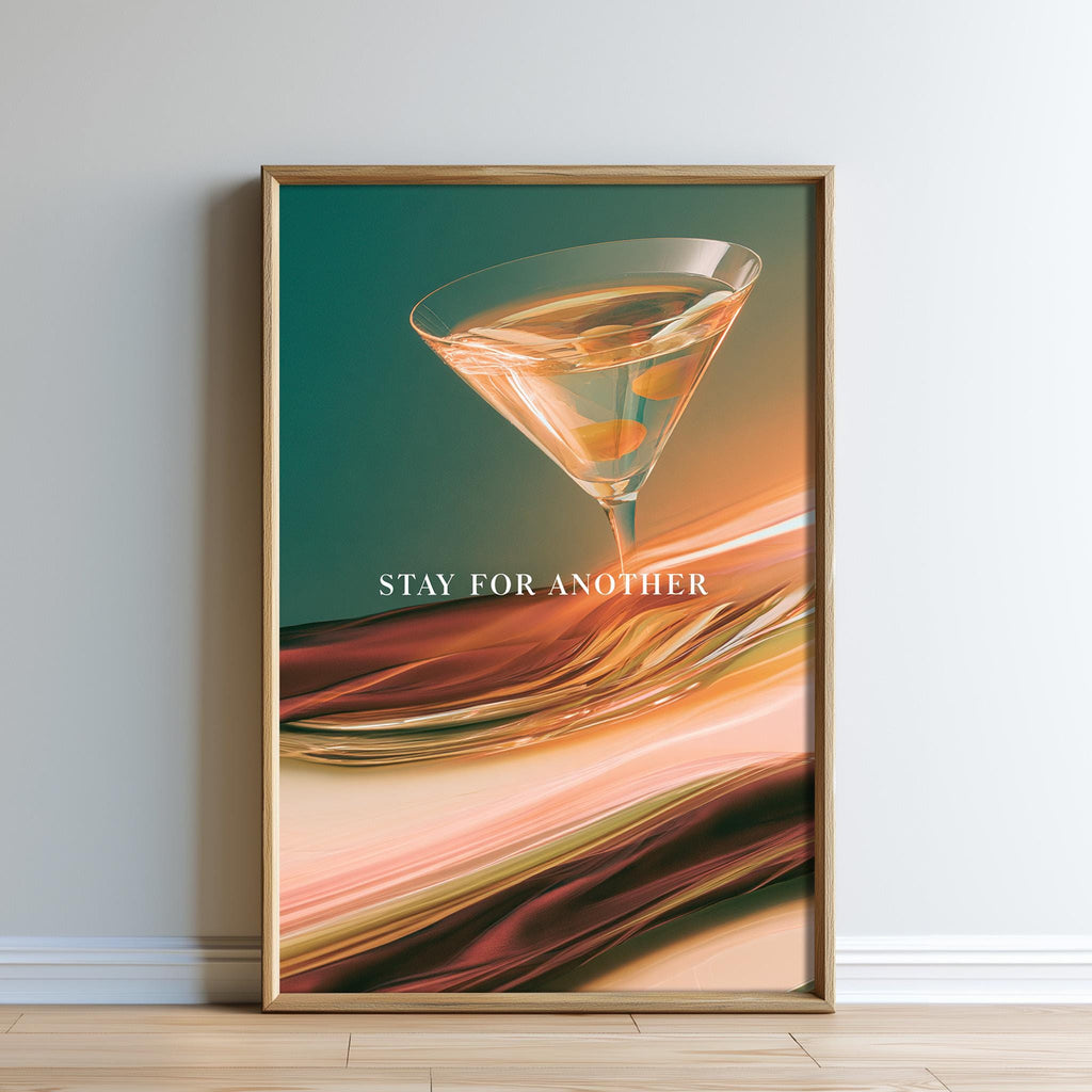 The image is a framed poster with a vibrant, abstract design featuring a martini glass filled with a colorful drink. The text "STAY FOR ANOTHER" is displayed prominently in the center of the poster.