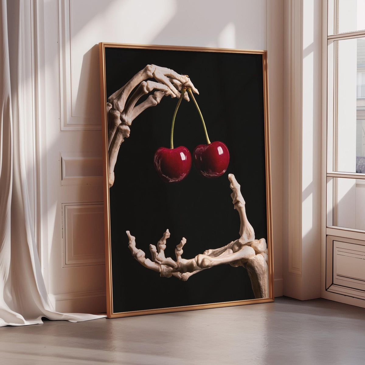 A skeleton hand holding two cherries against a black background, creating a striking and surreal visual.