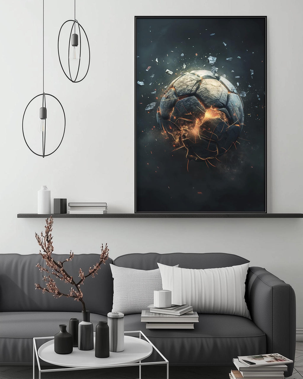 a large, striking painting of a soccer ball that appears to be in the midst of a dramatic explosion, with fiery orange and red sparks emanating from it. The painting is displayed on a wall above a gray couch, which is adorned with various decorative items such as a potted plant, vases, and books. The overall setting suggests a modern, stylish living room or entertainment area.