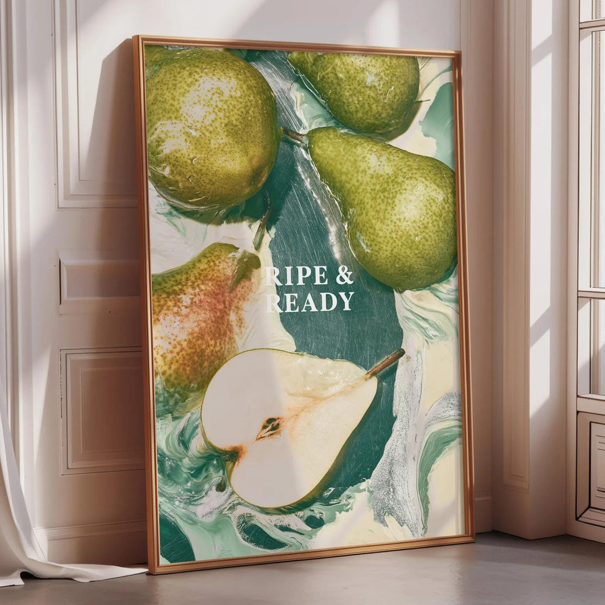 a framed poster with a vibrant display of pears, including whole pears and a sliced pear, arranged in a visually appealing manner.