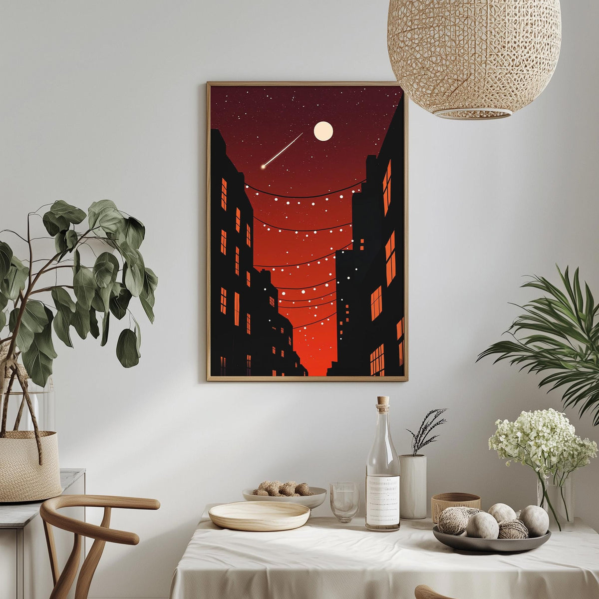 a dining table set with plates, bowls, and a bottle, with a framed picture of a cityscape hanging on the wall above it.