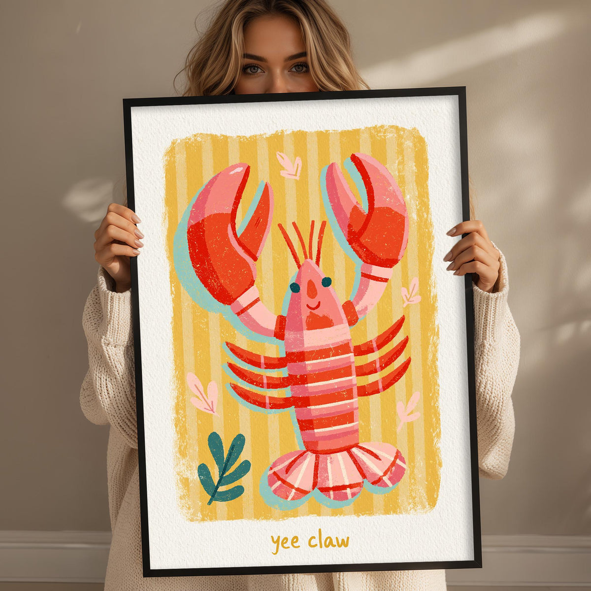 A woman is holding up a framed picture of a lobster with its claws spread out.