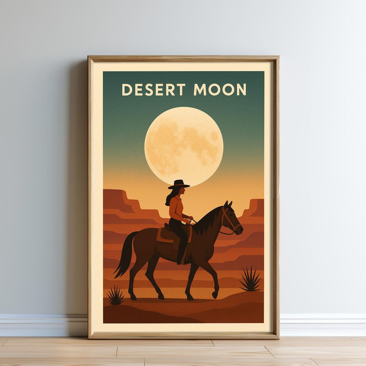 The image is a framed poster depicting a cowboy riding a horse in a desert landscape with a large moon in the sky.