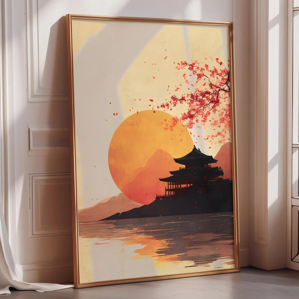 a large framed artwork depicting a serene landscape with a temple in the background and a large orange sun in the sky.