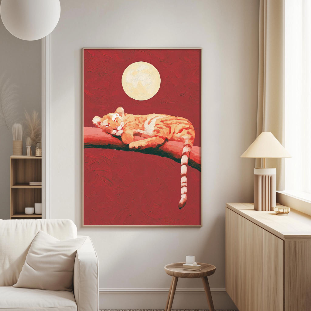 a large, vibrant painting of a tiger resting on a branch, with a full moon in the background. The painting is hanging on a wall in a living room setting, with a white couch and a small table nearby.