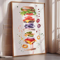 A framed watercolor painting depicting a large, multi-layered burger with various toppings and condiments.