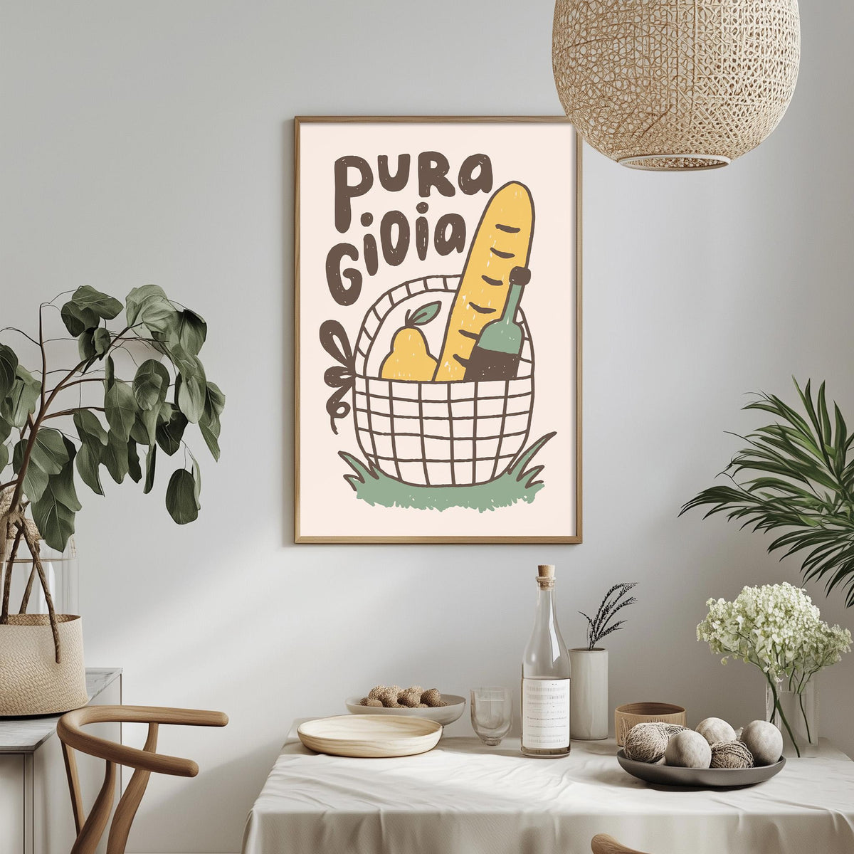a dining table with a bowl of fruit, a bottle, and a vase, along with a potted plant and a hanging light fixture. Above the table, there is a framed poster with the text "PURA GIOLA" and an illustration of a basket with various fruits and vegetables.