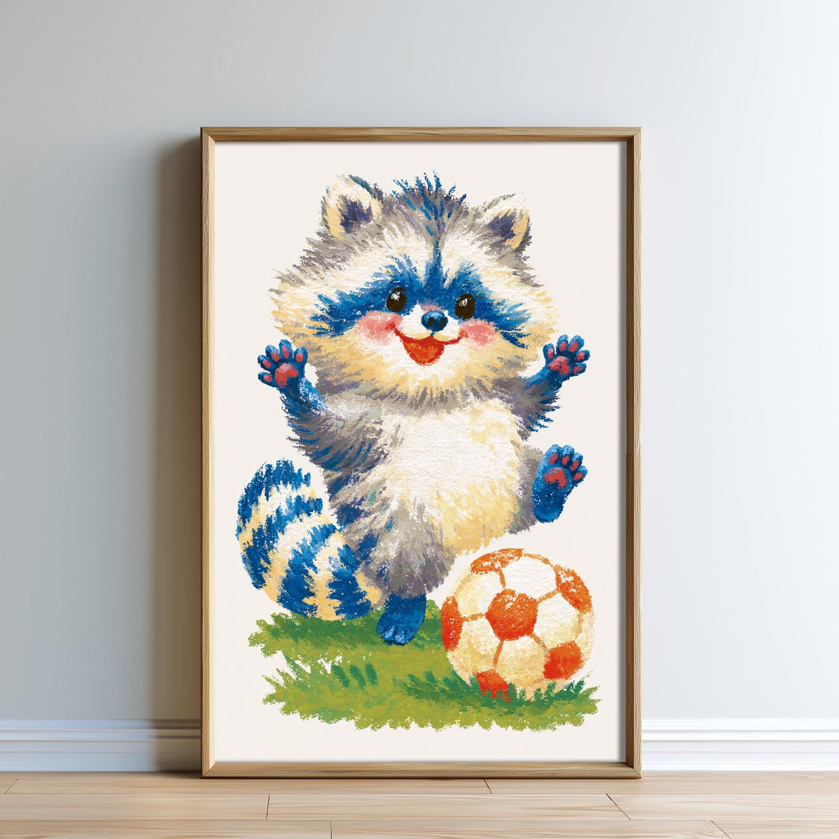 A framed painting depicting a raccoon standing on a soccer ball, with a soccer ball and a grassy field in the background.