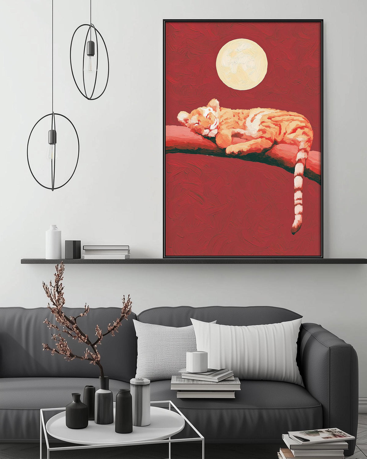 a cozy living room with a gray sofa, a coffee table, and a large framed painting of a tiger resting on a branch. The painting is hanging on the wall above the sofa, creating a focal point in the room.