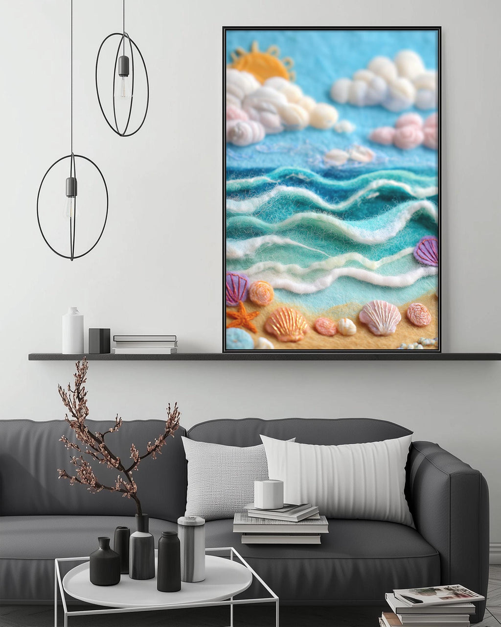 a large framed artwork depicting a serene beach scene with a blue sky, white clouds, and a sandy beach with seashells and starfish. The artwork is hanging on a wall above a gray couch, which is decorated with a small tree and various decorative items.