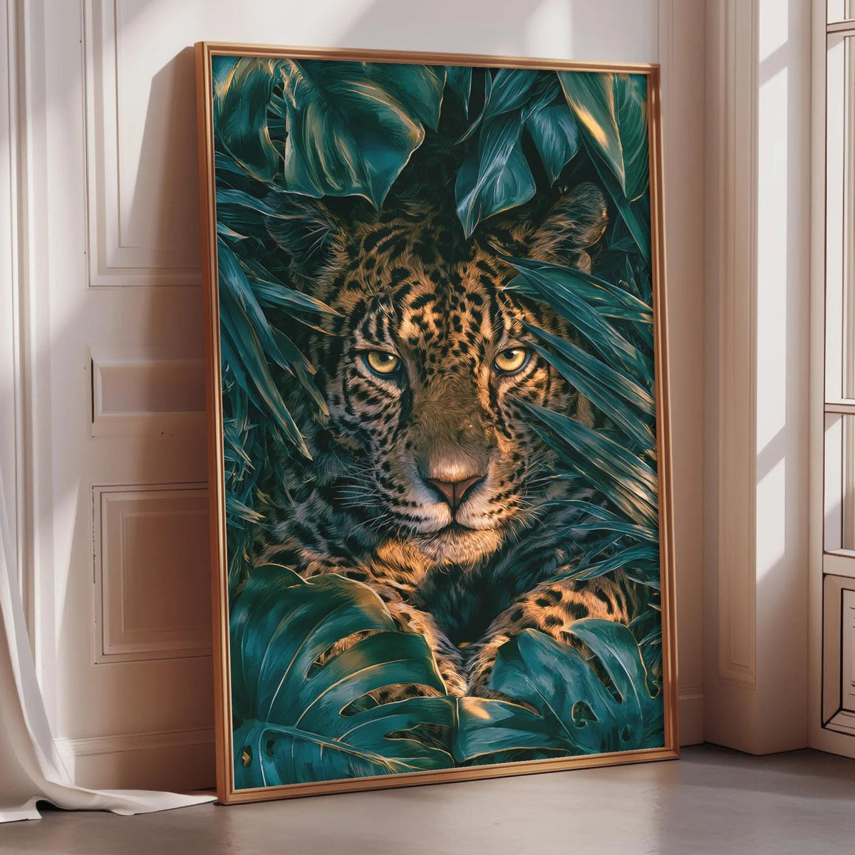 A framed painting of a jaguar resting in lush green foliage, with its striking orange and black spotted face visible through the leaves.