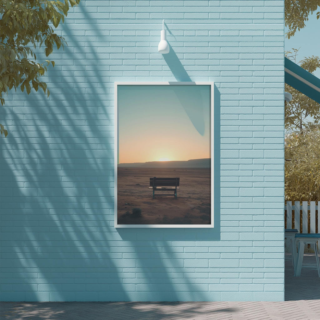 a serene scene of a bench in a desert landscape, with a warm sunset in the background.