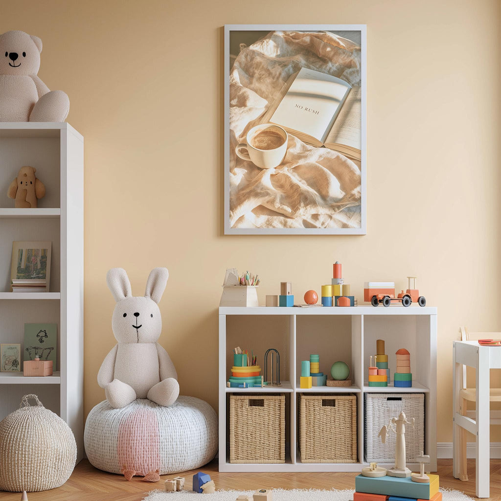 A cozy and well-organized children's playroom with a variety of toys and storage solutions. The room has a warm, inviting atmosphere with a beige color scheme. A large stuffed rabbit sits on a white bean bag chair, and a bookshelf filled with books and toys is visible. A framed picture of a cup and a book is displayed on the wall, adding a personal touch to the space.