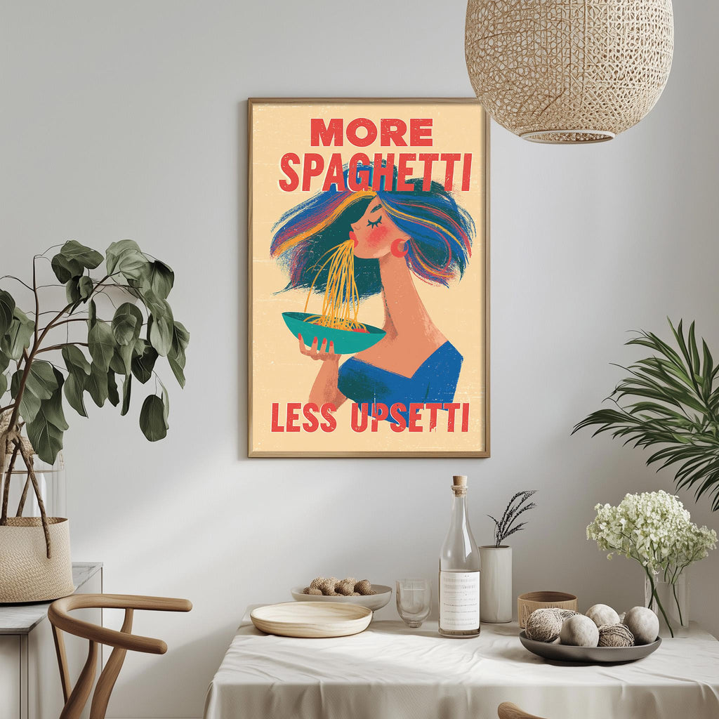 a framed poster with a woman eating spaghetti, accompanied by the text "MORE SPAGHETTI LESS UPSETTI".
